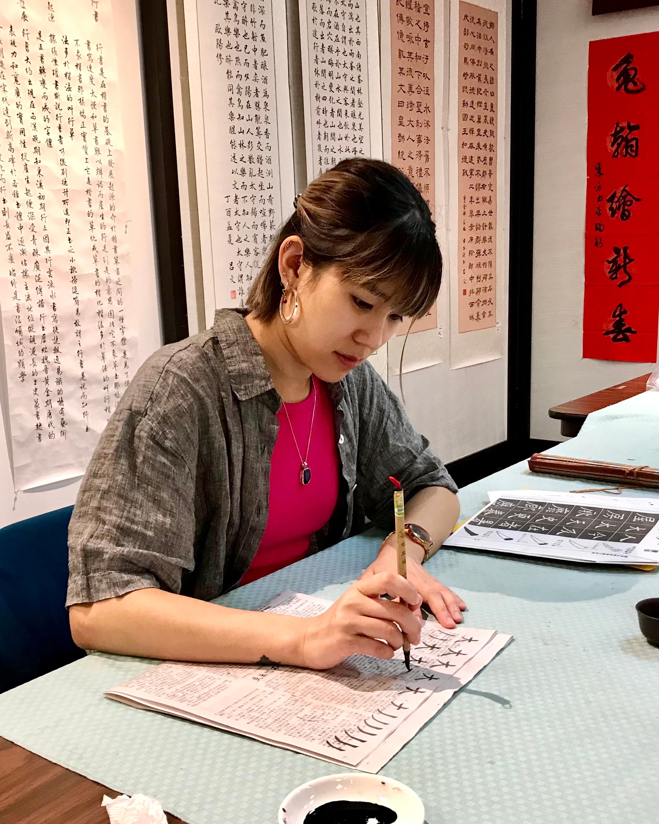 Bonnie practicing Chinese brush calligraphy